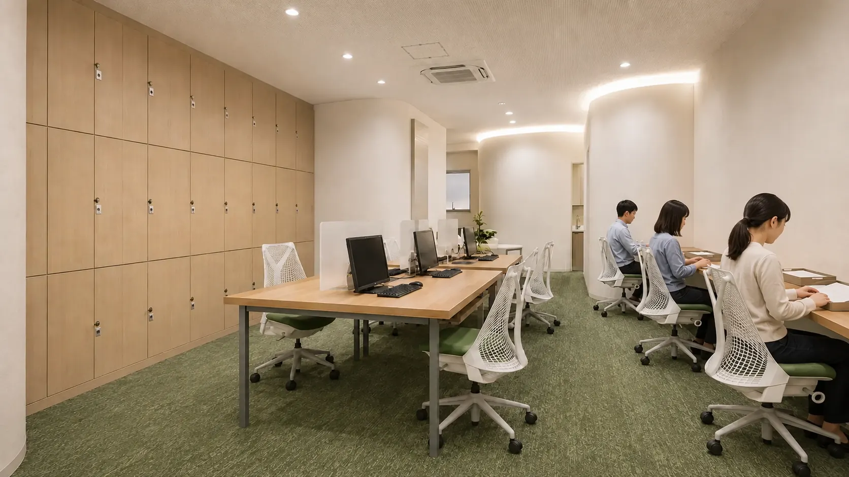 作業スペースで、利用者がそれぞれの席でパソコン作業をする様子のイメージ